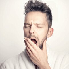 Tired person suggesting need for restful sleep
